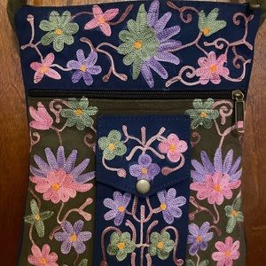 Gently used small boho crossbody cloth bag with 4 compartments.